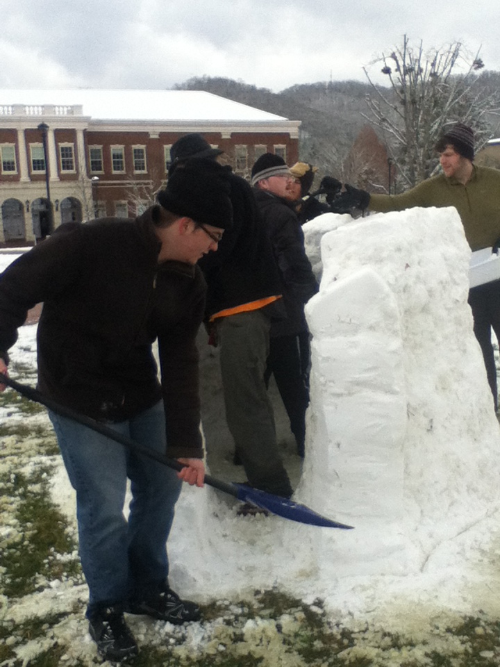 Snow Day 2013 3 Aaron Littlefield uses the help of fellow students to build an igloo. Photo by Brandy Carl.