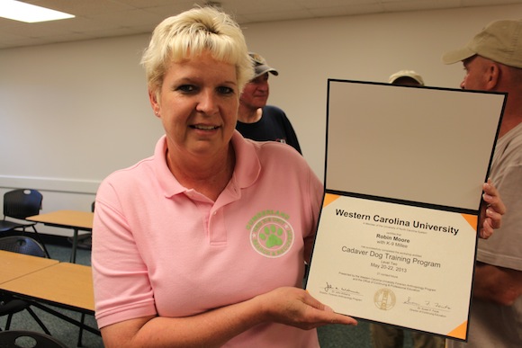 Cadaver Dog Training 11 Robin Moore smiles with her certificate after completing the level two cadaver dog training program at WCU. Photo by Ben Haines.